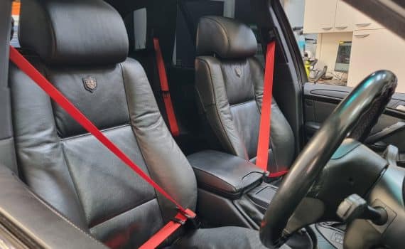 red seat belts in a BMW X5